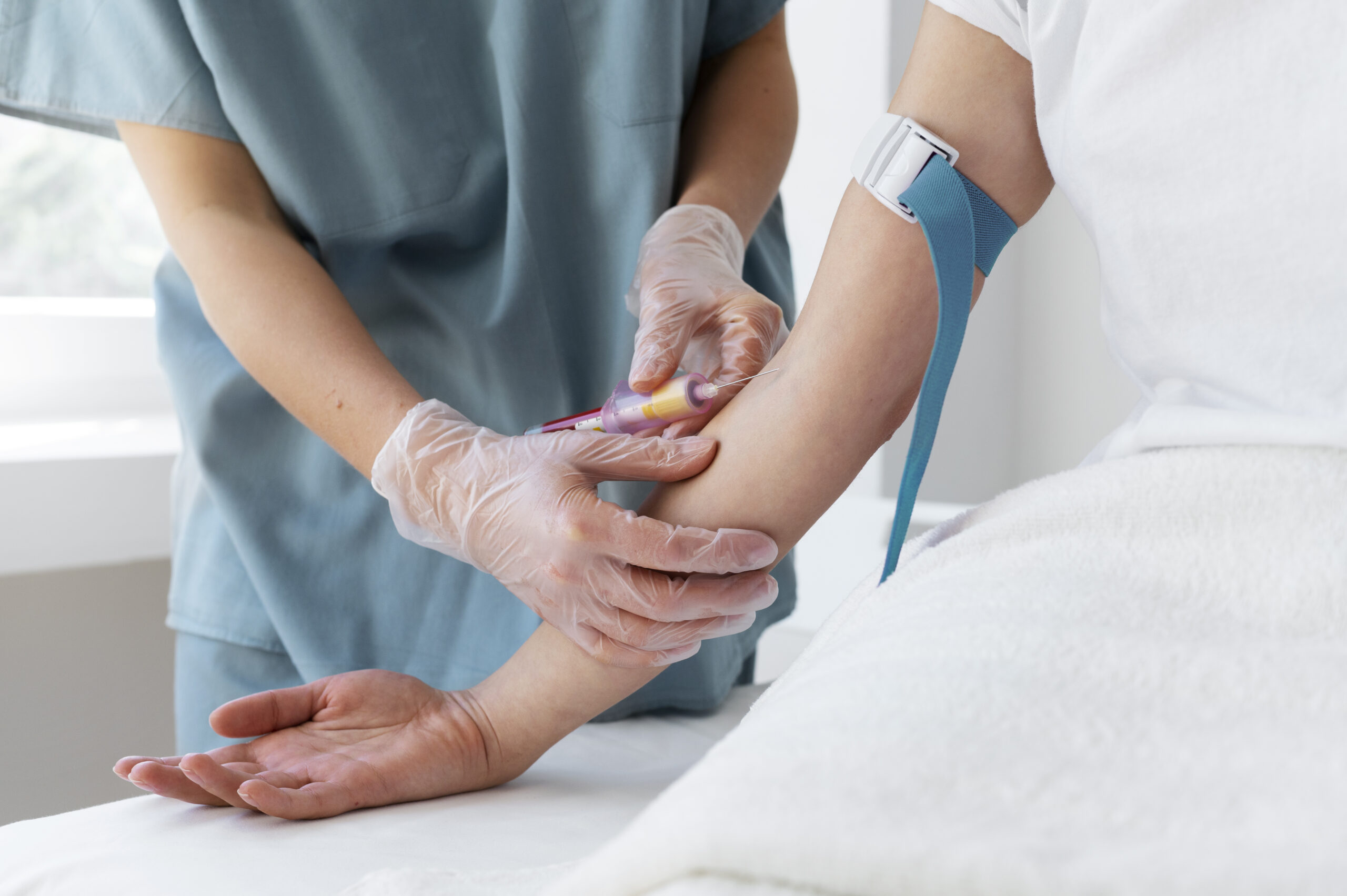 high-angle-health-professional-drawing-blood-prp-treatment